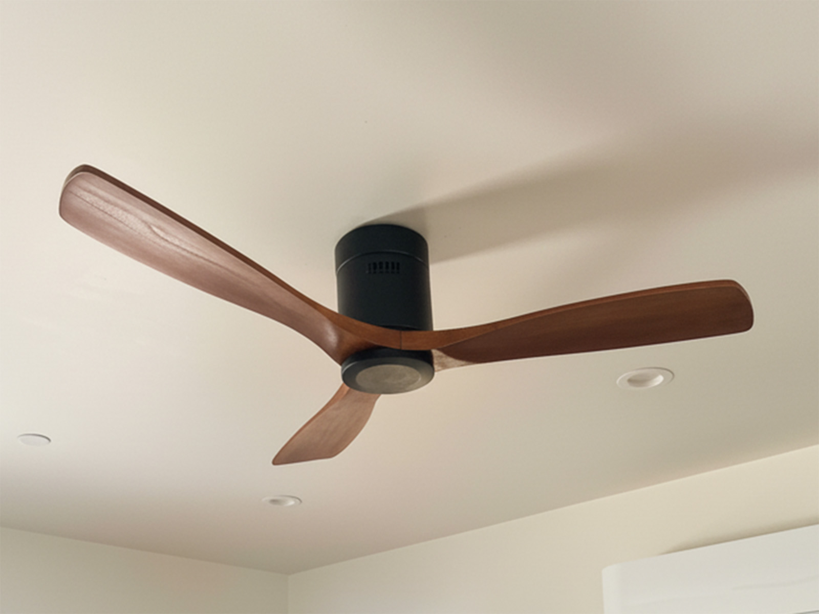 Completed ceiling fan installation including electrical wiring, secure mounting, and balance adjustment