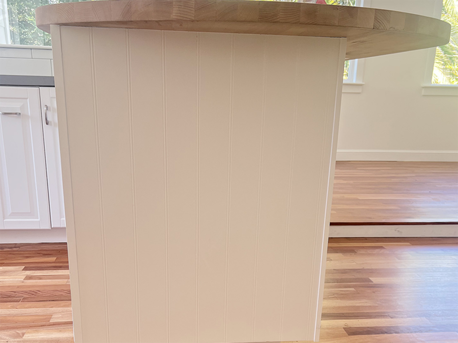 Added custom wainscoting to kitchen island and professionally cleaned and restored kitchen cabinets